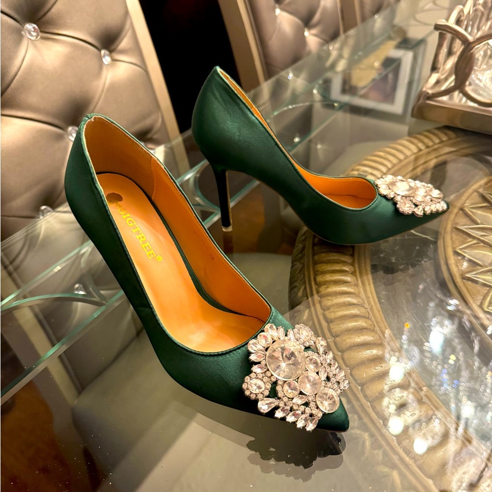 Green pump shoes with rhinestones.